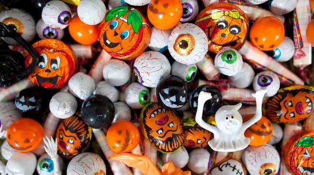 Assorted foil-wrapped Halloween candies: pumpkins, eyeballs, werewolves, ghosts, etc.