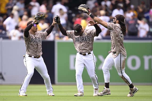 Sep 3, 2023; San Diego, California, USA; San Diego Padres left fielder Juan Soto (22) celebrates with center fielder Trent Grisham (1) and right fielder Fernando Tatis Jr. (23) after defeating the San Francisco Giants at Petco Park.