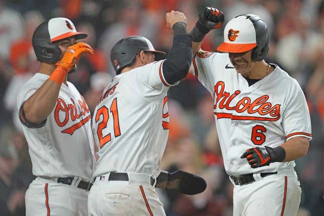 Apr 11, 2023; Baltimore, Maryland, USA; Baltimore Orioles first baseman Ryan Mountcastle (6) greeted by outfielders Austin Hays (21) and Anthony Santander (25) following his seventh inning grand slam against the Oakland Athletics at Oriole Park at Camden Yards.