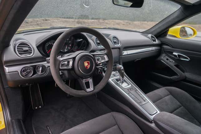 The black interior of the 2022 Porsche Cayman GTS 4.0