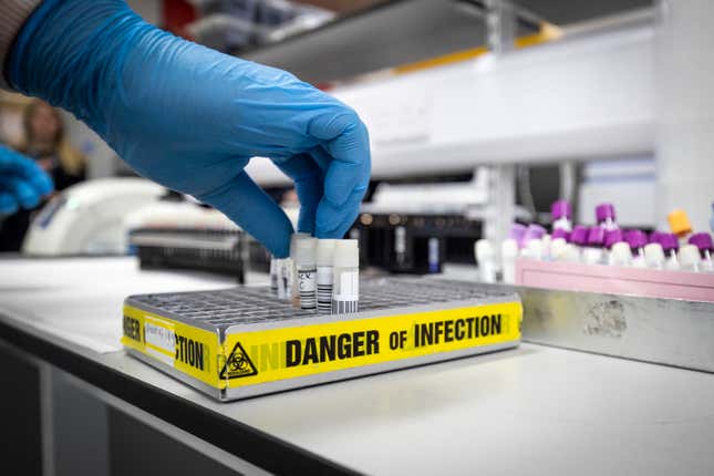 Vials in a lab with tape warning Danger of Infection