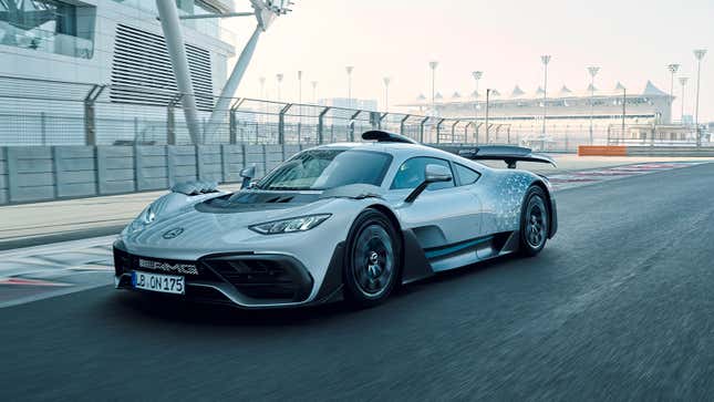 Photo of a Mercedes-AMG One on a racetrack, seen from the driver-side front-quarter.
