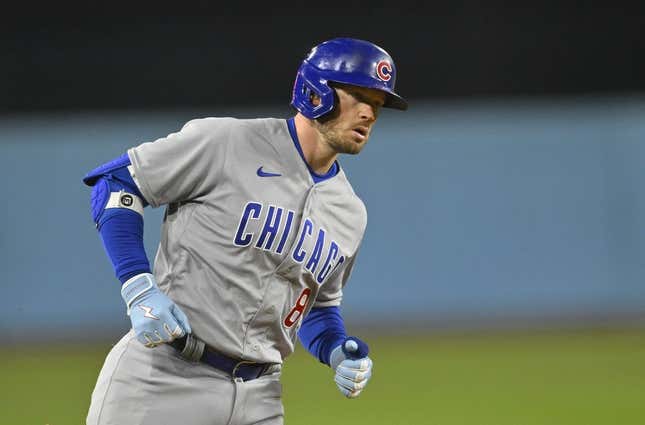 Apr 14, 2023; Los Angeles, California, USA;  Chicago Cubs left fielder Ian Happ (8) rounds the bases on a solo home run in the ninth inning against the Los Angeles Dodgers at Dodger Stadium.