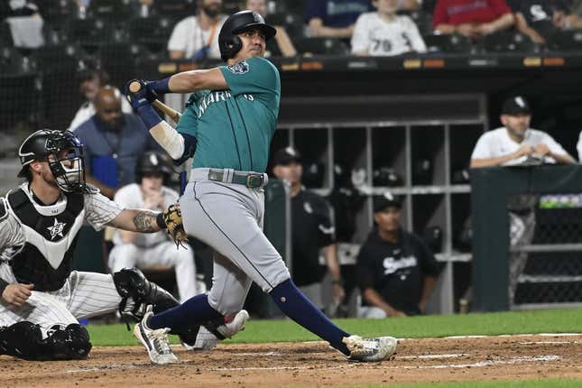 Aug 22, 2023; Chicago, IL, USA; Seattle Mariners third baseman Josh Rojas (4) hits a two-run home run against the Chicago White Sox in the fourth inning in guaranteed rate field.