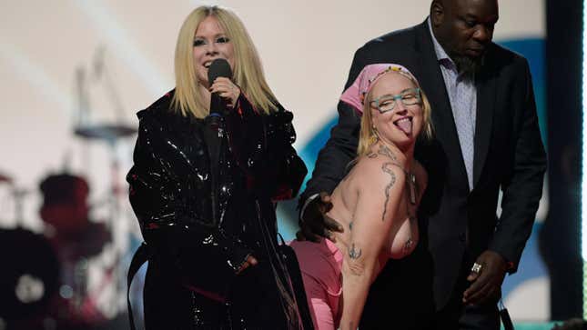 Image for article titled Avril Lavigne Tells Topless Protestor to &#39;Get the Fuck Off, Bitch’ While Presenting at Juno Awards