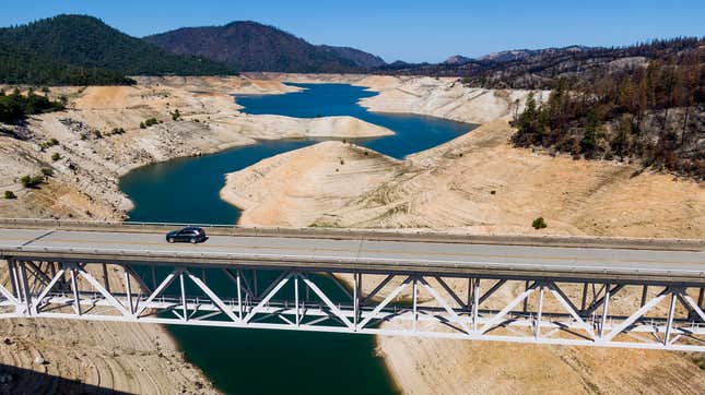 A car crosses Enterprise Bridge over Lake Oroville’s dry banks on May 23, 2021, in Oroville, California.
