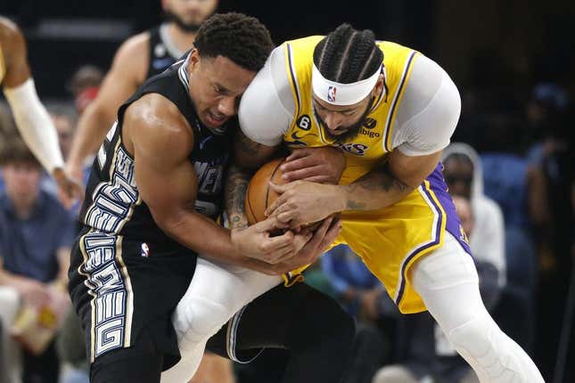 Apr 19, 2023; Memphis, Tennessee, USA; Memphis Grizzlies guard Desmond Bane (22) and Los Angeles Lakers forward Anthony Davis (3) fight for control of the ball during the first half during game two of the 2023 NBA playoffs at FedExForum.