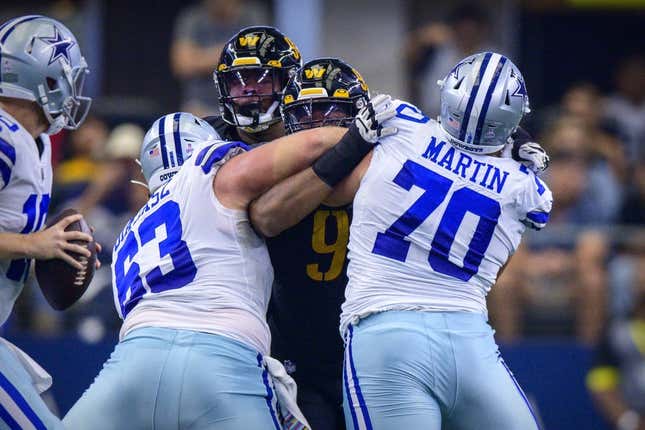 Oct 2, 2022; Arlington, Texas, USA; Dallas Cowboys center Tyler Biadasz (63) and guard Zack Martin (70) double team Washington Commanders defensive tackle Daron Payne (94) during the first quarter at AT&amp;amp;T Stadium.