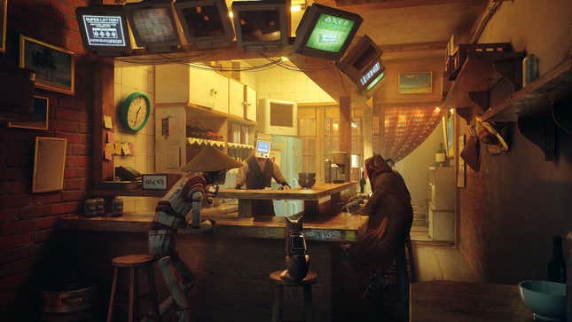 A screenshot from Stray depicting the player character sitting at a bar with a couple of other machines with monitors for heads.