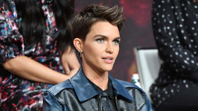 Ruby Rose in a blue and black jacket at a 2019 red carpet event.