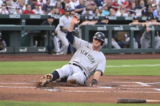 Jul 1, 2023; St. Louis, Missouri, USA; New York Yankees designated hitter DJ LeMahieu (26) slides in safely to home plate for a run against the St. Louis Cardinals in the first inning in game two of a double header at Busch Stadium.