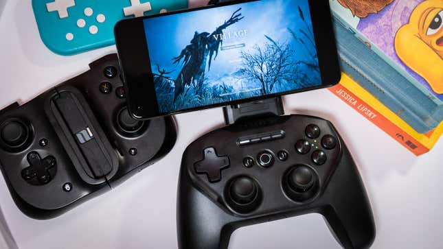 A photo of the Stratus+, surrounded by other controllers and some books