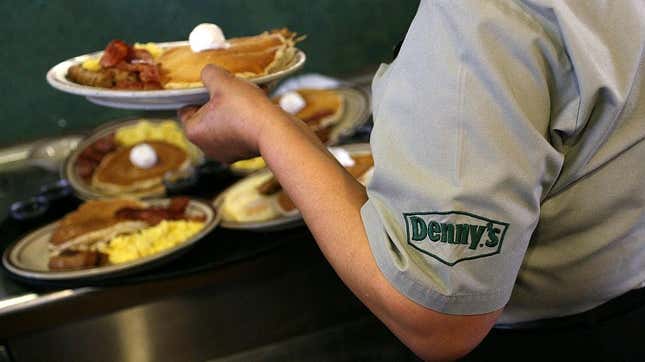 Denny's server with breakfast platters