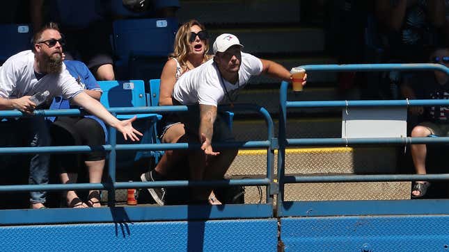 Image for article titled So-Called Diehard Fan Won’t Even Leap Over Stadium Railing To Catch T-Shirt