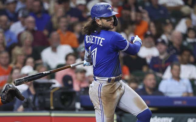 Apr 18, 2023; Houston, Texas, USA; Toronto Blue Jays shortstop Bo Bichette (11) hits an RBI single during the fifth inning against the Houston Astros at Minute Maid Park.