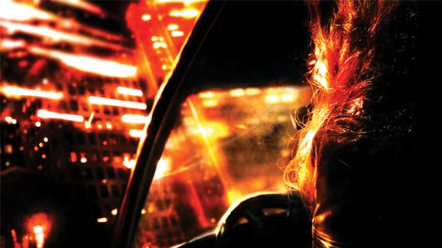 A stylized image shows a city beyond the windshield of a car.