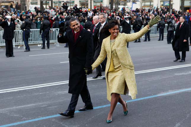 Former President Barack Obama and first lady Michelle Obama walk the inaugural parade route in Washington, Jan. 20, 2009.