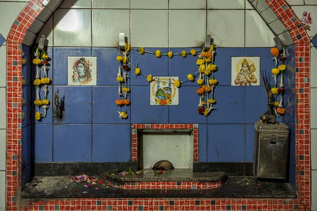 Pir Baba shrine under Narkeldanaga railway tracks contains both Muslim and Hindu images.