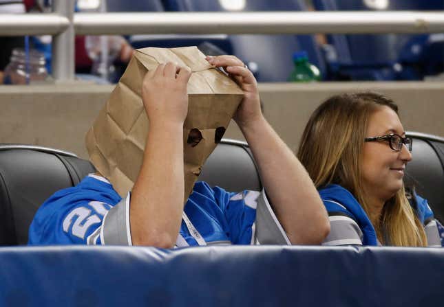This Lions fan is probably not wearing a paper bag over his head to be fashionable.
