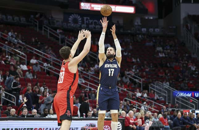 Mar 19, 2023; Houston, Texas, USA; New Orleans Pelicans center Jonas Valanciunas (17) shoots the ball over Houston Rockets center Alperen Sengun (28) during the first quarter at Toyota Center.