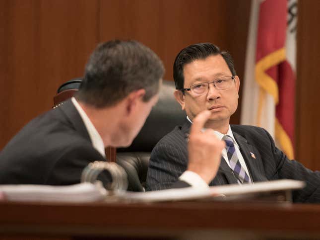 Supervisor Andrew Do, right, listens to Supervisor Todd Spitzer, left, during questioning of Orange County District Attorney Tony Rackauckas in front of the Orange County Board of Supervisors meeting Tuesday in Santa Ana on Tuesday, June 27, 2017. 