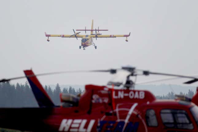 French Bombardier 415 firefighting aircraft is seen landing as part of an international effort to battle a wildfire that has been raging for more than a week, Sveg, Sweden on July 21, 2018.
