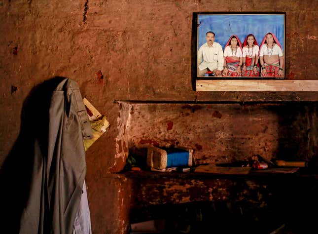 A picture of Sakharam Bhagat, with his wives, Tuki, Sakhri and Bhaagi (L to R) is seen on a wall inside their house
