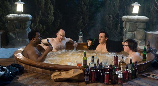four men in a hot tub.