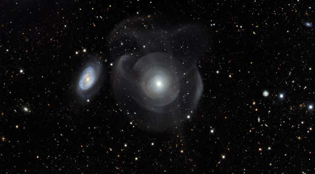 NGC 474 has wispy shells surrounding it.