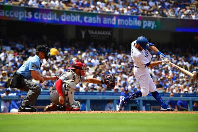 Apr 30, 2023; Los Angeles, California, USA; Los Angeles Dodgers shortstop Chris Taylor (3) hits an RBI double against the St. Louis Cardinals during the fourth inning at Dodger Stadium.