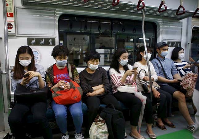 Rail passengers in Seoul.