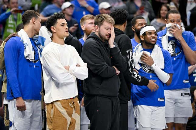 Apr 7, 2023; Dallas, Texas, USA; Dallas Mavericks guard Josh Green (8) and guard Luka Doncic (77) and forward Reggie Bullock (25) and forward Markieff Morris (13) and center JaVale McGee (00) watch the game between the Dallas Mavericks and the Chicago Bulls during the second half at the American Airlines Center.