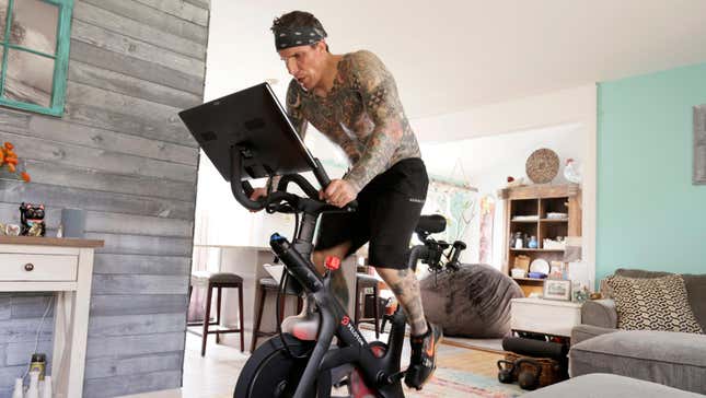 rody Longo works out on his Peloton exercise bike on April 16, 2021 in Brick, New Jersey. 