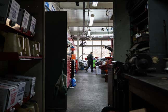An auto mechanic walks through a repair shop on January 13, 2022 in Louisville, Kentucky. 