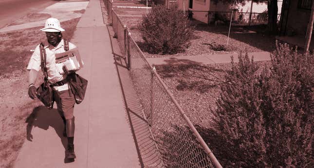 In this Friday, Aug. 26, 2011 photo, postal worker Chris Turner, 49, walks in front of a yard that has gravel instead of grass, in El Paso, Texas. The city started a successful water conservation program 20 years ago that included replacing grass with water saving landscaping plants and materials like gravel.