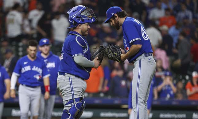 Apr 18, 2023; Houston, Texas, USA; Toronto Blue Jays catcher Alejandro Kirk (30) and relief pitcher Jordan Romano (68) celebrate after the Blue Jays defeated the Houston Astros at Minute Maid Park.