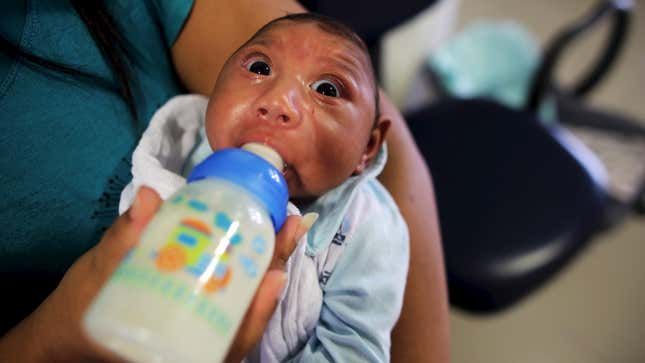 Jackeline, 30, feeds her son Gustavo Henrique, who is two months old and was born with microcephaly.