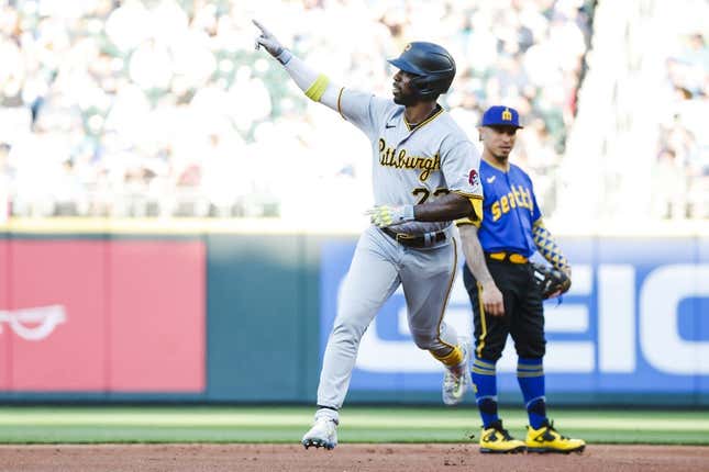 May 26, 2023;  Seattle, Washington, USA;  Pittsburgh Pirates designated hitter Andrew McCutchen (22) celebrates while running the bases after hitting a solo home run during the first inning at T-Mobile Park.