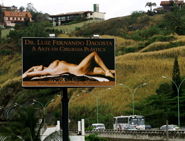 A billboard proclaiming "the art of plastic surgery"
