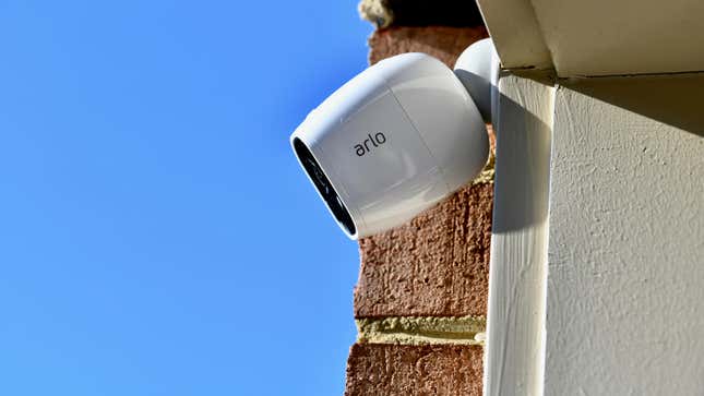 An Arlo wireless security camera displayed on the outside of a home