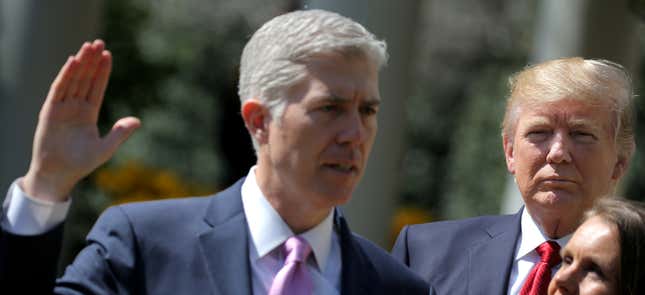 Gorsuch, left, is sworn in the Rose Garden.