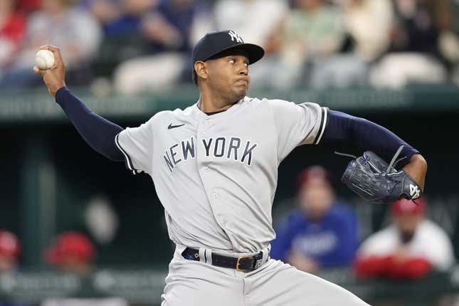 Apr 29, 2023; Arlington, Texas, USA; New York Yankees starting pitcher Jhony Brito (76) delivers against the Texas Rangers during the third inning at Globe Life Field.