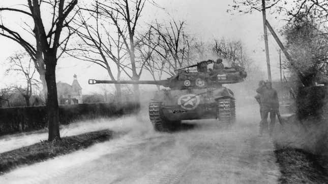 A black and white photo of a Buick Hellcat tank firing its gun. 