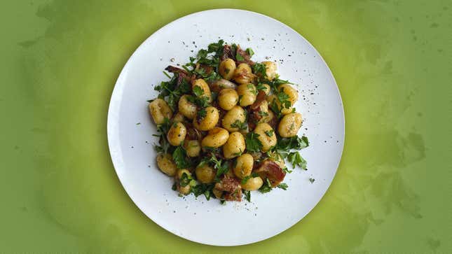 German potato salad made from gnocchi instead of potatoes, with bacon and parsley