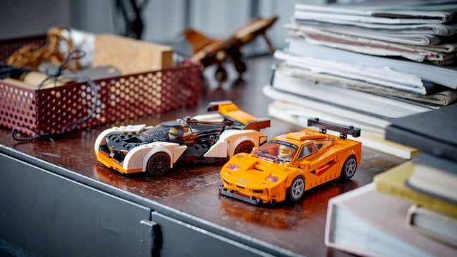 A photo of two model Lego McLaren cars. 