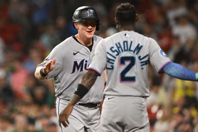 Jun 28, 2023; Boston, Massachusetts, USA; Miami Marlins first baseman Garrett Cooper (26) reacts with center fielder Jazz Chisholm Jr. (2) after scoring run against the Boston Red Sox during the sixth inning at Fenway Park.