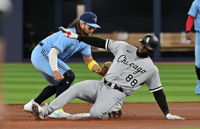 Apr 26, 2023; Toronto, Ontario, CAN;  Chicago White Sox center fielder Luis Robert Jr. (88) is tagged out at second base by Toronto Blue Jays shortstop Bo Bichette (11) in the first inning at Rogers Centre.
