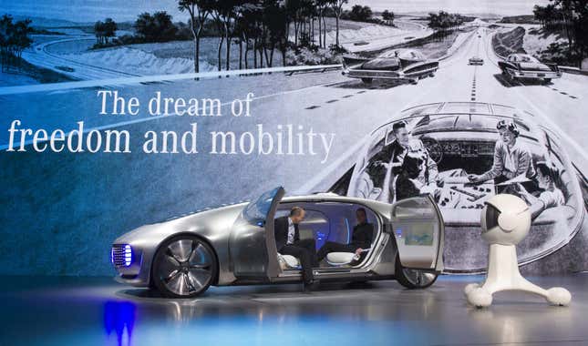 A couple gets into the Mercedes-Benz F015 Luxury in Motion autonomous concept car during the 2015 International Consumer Electronics Show (CES) in Las Vegas, Nevada, in this file photo taken January 5, 2015.