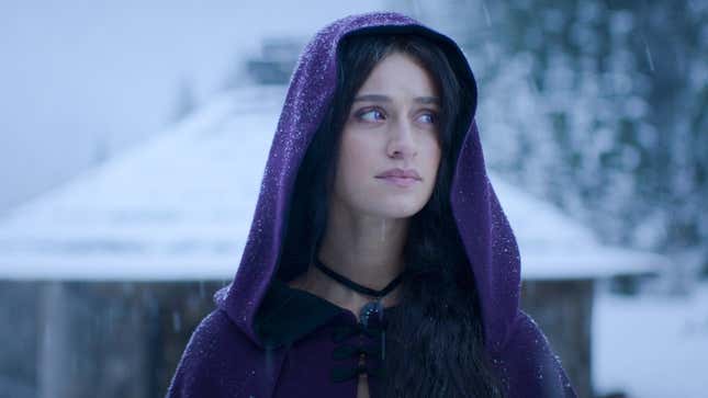 Anya Chalotra as Yennefer wearing a purple hooded cape in The Witcher season three.