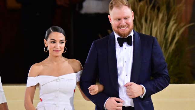 Alexandria Ocasio-Cortez and Riley Roberts leave the 2021 Met Gala Celebrating In America: A Lexicon Of Fashion at Metropolitan Museum of Art on September 13, 2021 in New York City